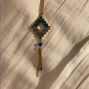 Long aztec print gold necklace